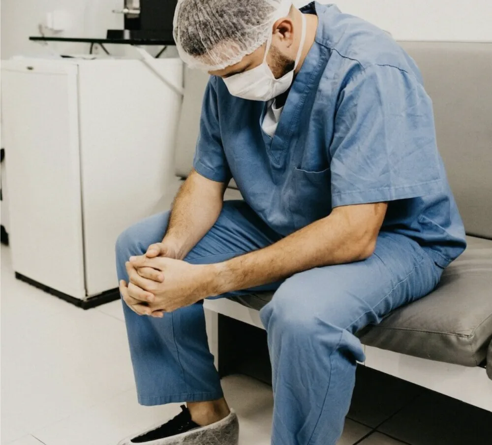 Emergency healthcare professional taking a quiet moment to decompress